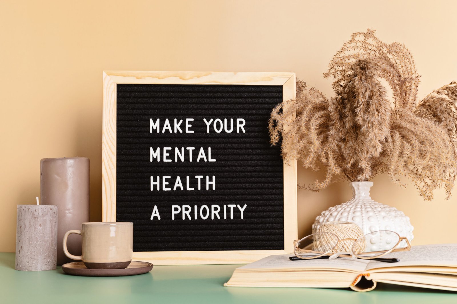 Make your mental health a priority motivational quote on the letter board. Inspiration psycological text in the interior