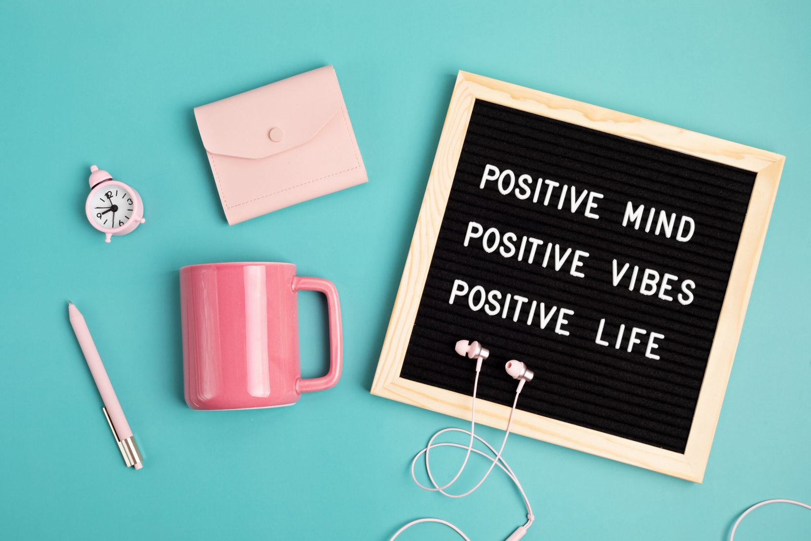 Positive mind, vibes, life motivational quote on the letter board. Inspiration text. Top view of the desktop